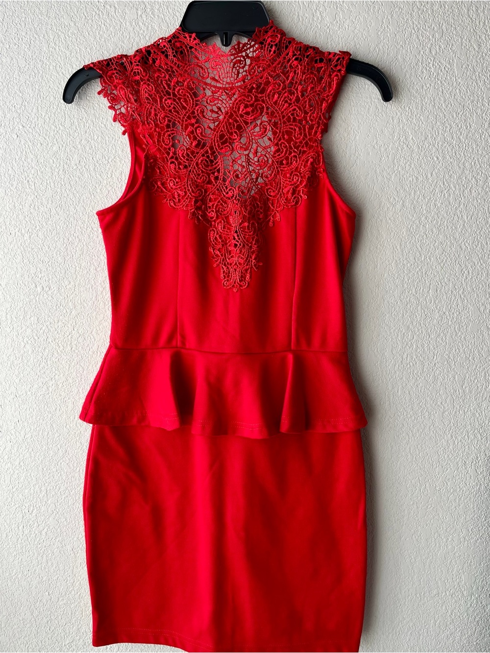 Red peplum dress intricate lace detailing on the neckline. Size S